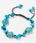 Blue Howlite chip and turtle thread bracelet symbolising calm, protection, and wisdom. Adjustable cord design associated with the Throat Chakra.