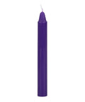 Purple candle on a white background