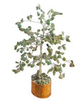 Jade healing crystal tree with green gemstone leaves on wooden base