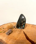 Labradorite Freeform Crystal – a polished labradorite freeform with flashes of iridescent colour, known for intuition, protection, transformation, and spiritual awareness.