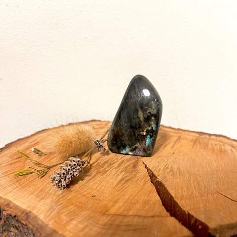 Labradorite Freeform Crystal – a polished labradorite freeform with flashes of iridescent colour, known for intuition, protection, transformation, and spiritual awareness.