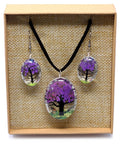 Close-up of Tree of Life jewellery set with real pressed lavender flowers in glass pendant and earrings