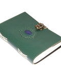 green leather journal with mandala embossing and clasp closure showing thickness and page quality