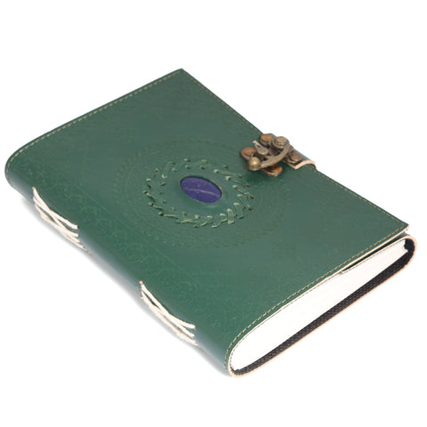 green leather journal with mandala embossing and clasp closure showing thickness and page quality