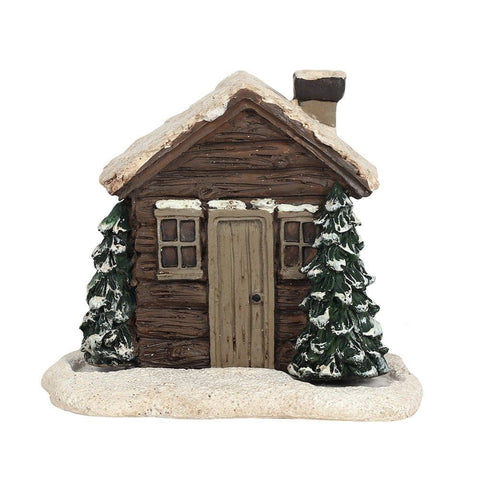 Front view of rustic log cabin incense burner with snow and trees.