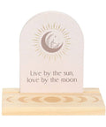 Luna Moth Affirmation Card with message “Live by the sun, love by the moon” on wooden moon phase stand.