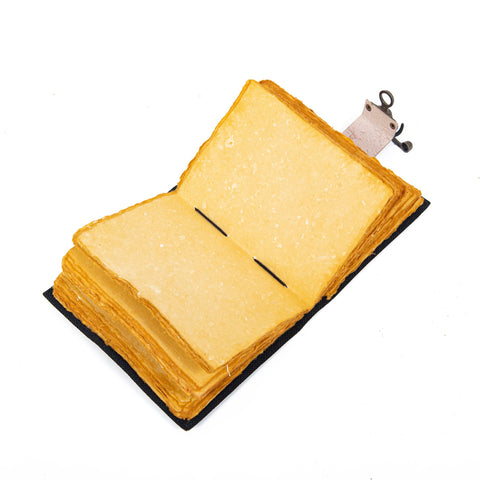 Mother earth leather journal open showing handmade vintage deckle edge paper pages