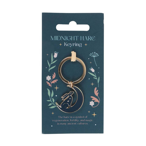 Close-up of Mystical Midnight Hare Keyring on presentation card featuring celestial floral design