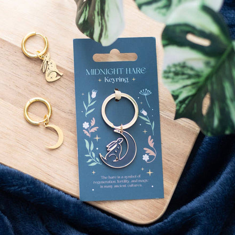 Mystical Midnight Hare Keyring displayed on blue card with gold moon and hare earrings beside it