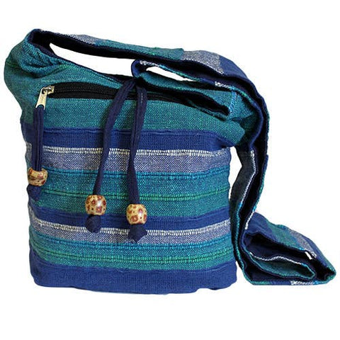 Blue Nepal sling bag with wide strap and zip pocket in striped woven fabric for everyday use and travel