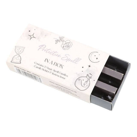 Protection spell in a box with three grey ritual candles