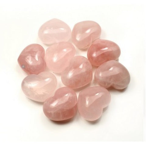 Selection of rose quartz polished puff hearts showing natural variation in soft pink colour on white background — Fragrant Heaven