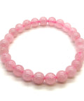 Rose quartz round bead stretch bracelet on white background showing soft pink colour — Fragrant Heaven