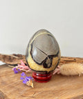 Septarian crystal egg with natural brown, yellow and black patterns for grounding and strength
