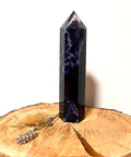 Sodalite Tower – a polished sodalite tower crystal with deep blue and white tones, known for clarity, calm, communication, and balance.