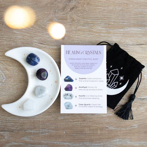 Healing Crystal Set with moon trinket dish, crystal card and drawstring pouch on wooden surface