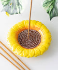 Sunflower ceramic incense holder plate on table