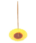 Sunflower incense stick holder with upright incense stick on white background