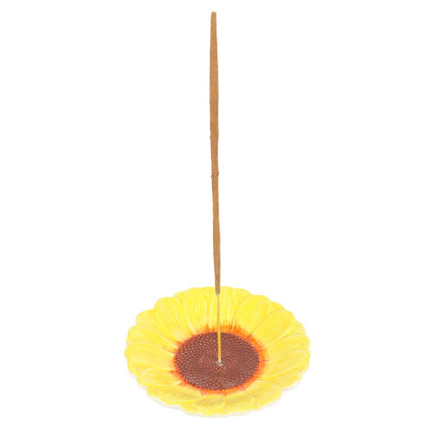 Sunflower incense stick holder with upright incense stick on white background
