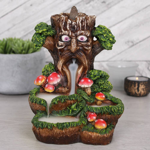 Tree Man Backflow Incense Burner with smoke cascading downwards.