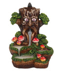 Front view of Tree Man Backflow Incense Burner with mushrooms and green leaves.