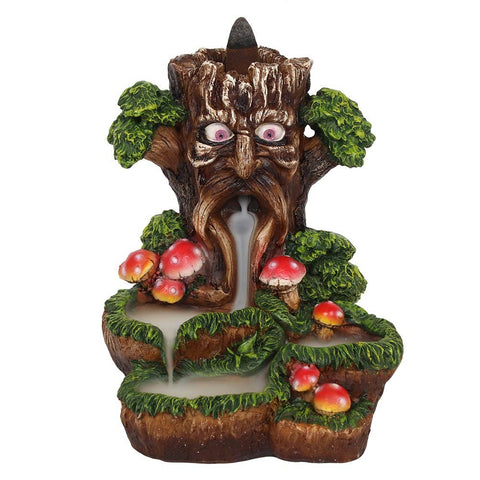 Front view of Tree Man Backflow Incense Burner with mushrooms and green leaves.