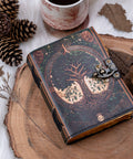 Tree of life leather journal styled on wooden surface with natural elements