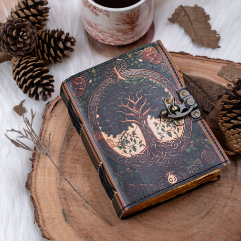 Tree of life leather journal styled on wooden surface with natural elements