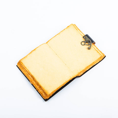 Tree of life leather journal open showing handmade vintage deckle edge paper pages