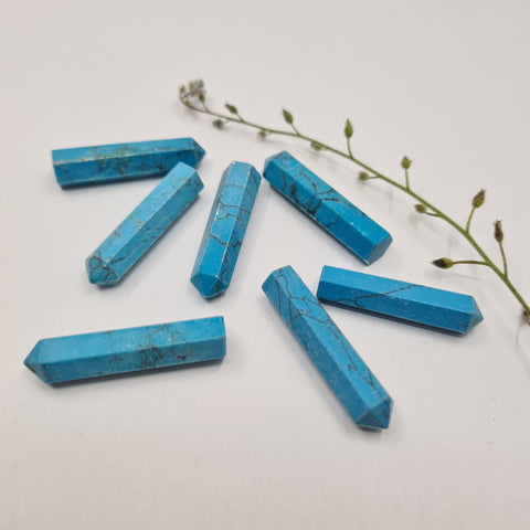 Turquoise Howlite crystal point with soft blue tones symbolising calm, balance, and clear communication. Associated with the Throat Chakra and signs Virgo and Gemini.