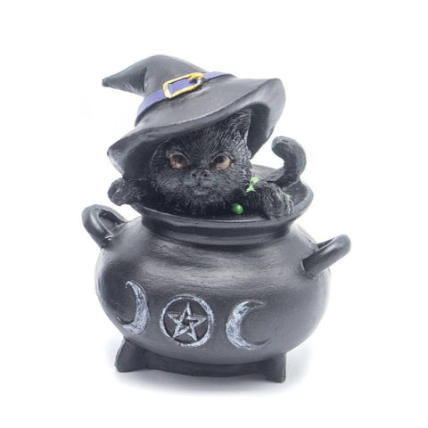 Statue featuring black cat with black witch hat sitting in cauldron decorated with pentagram and triple moon symbols. Represents protection, transformation, and feminine energy in Wicca.