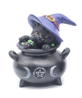 Statue featuring black cat with purple witch hat sitting in cauldrons decorated with pentagram and triple moon symbols. Represents protection, transformation, and feminine energy in Wicca.