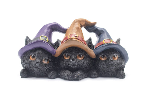 Resin statue of three black cats wearing pointed witch hats, symbolizing mystery, wisdom, independence, and feminine energy in Wicca.