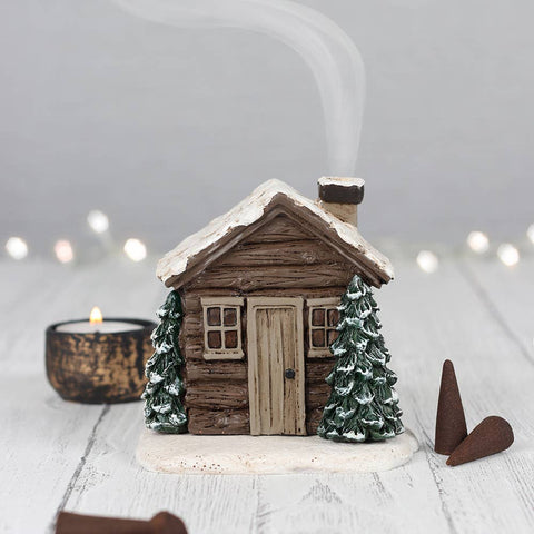 Winter Log Cabin Incense Cone Burner with smoke rising from the chimney.