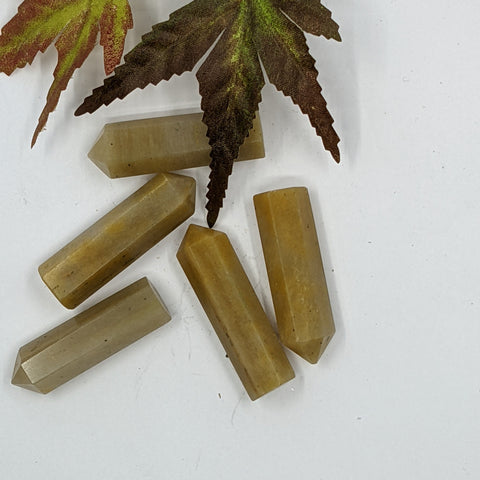Yellow Jasper crystal point with golden tones symbolising protection, grounding, and confidence. Associated with the Solar Plexus Chakra and signs Leo and Virgo.